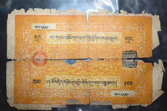 A group of Tibetan objects, including a flint lighter, a bullet bag, two pendants, a relic box and three banknotes